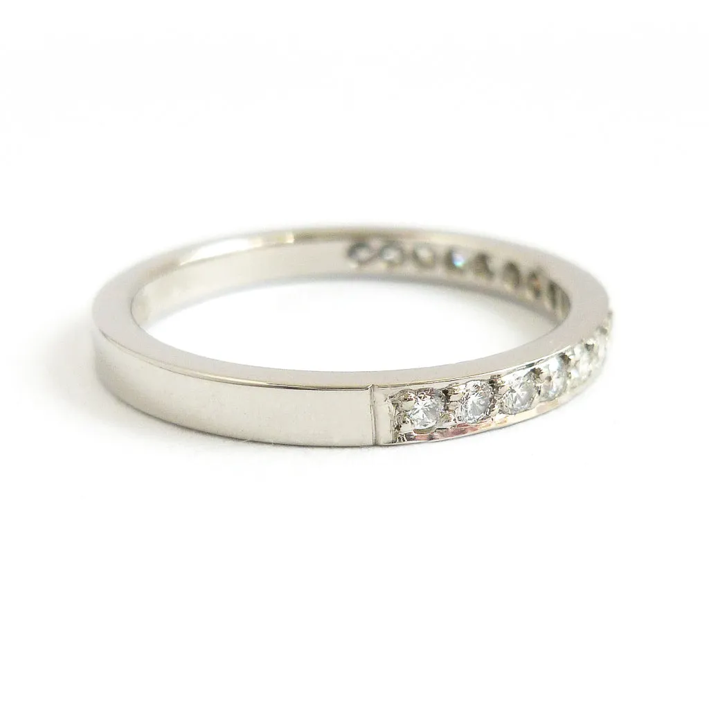 Classic platinum eternity or wedding ring with 17 pave set white diamonds