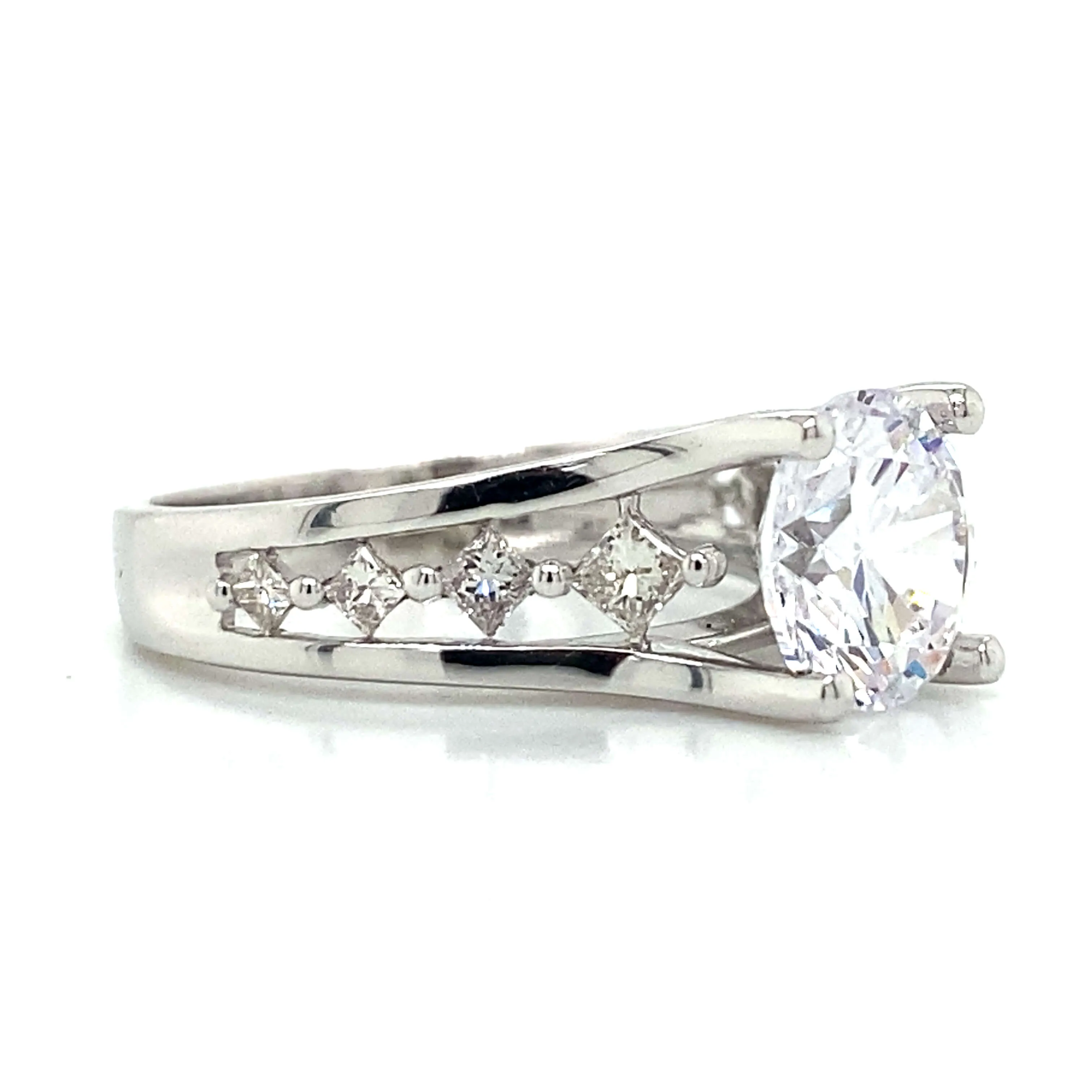 Side Stone Graduating Floating Set Engagement Ring in 18K White Gold