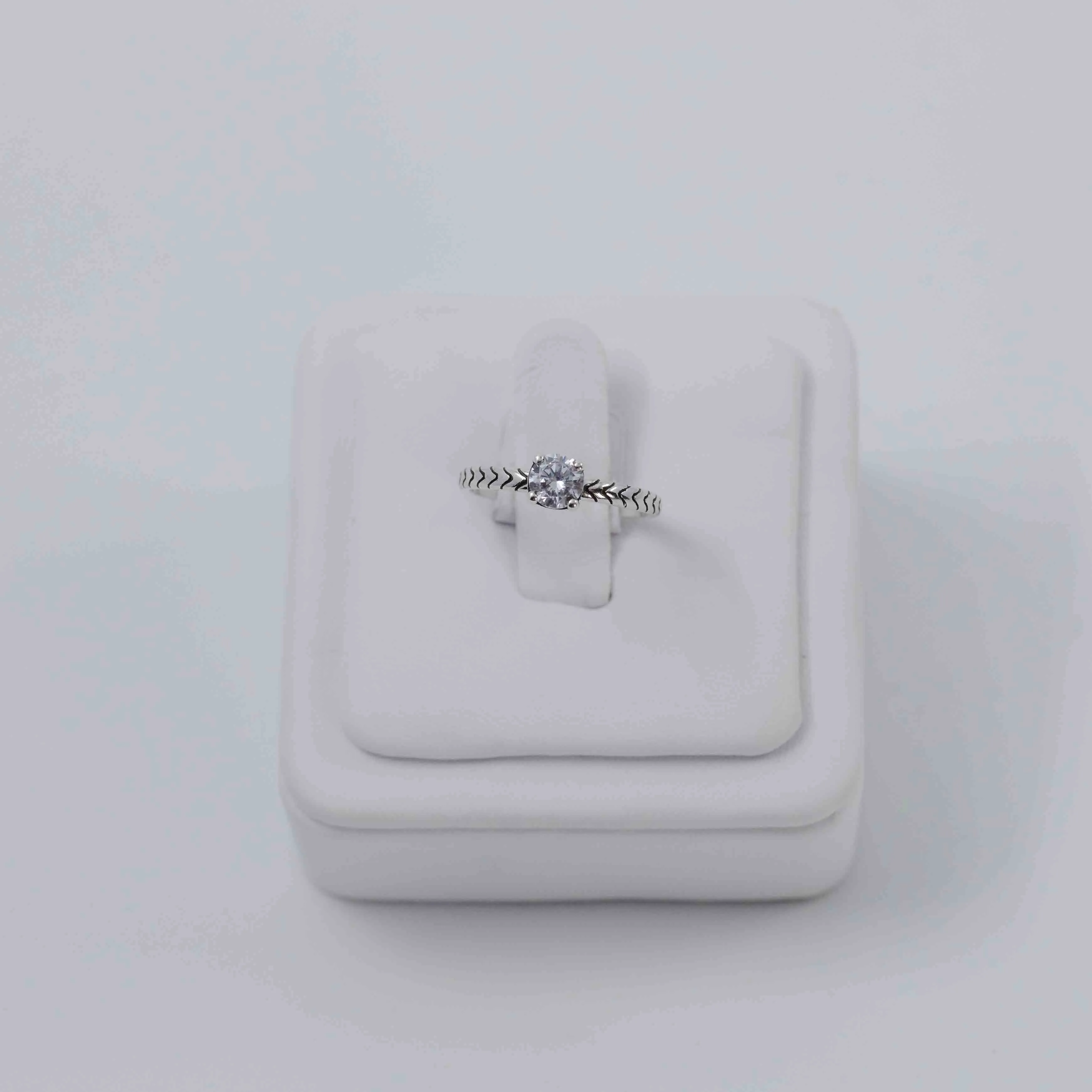 Simple solitaire silver ring