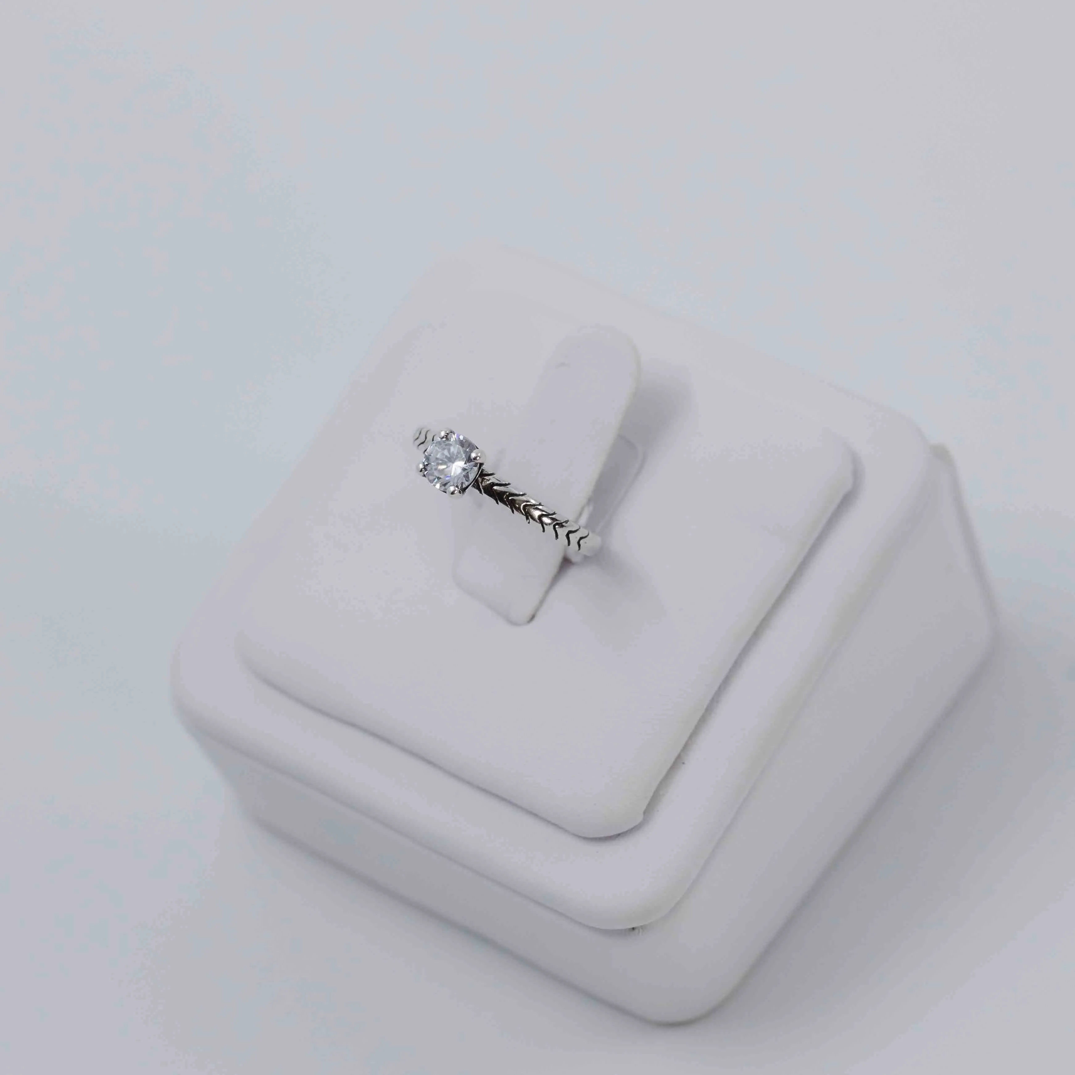 Simple solitaire silver ring